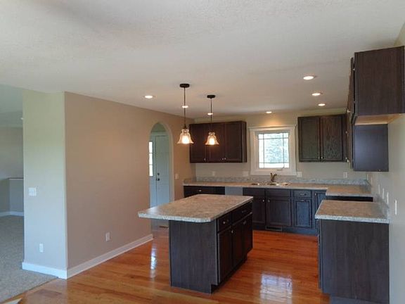 Additional view of the kitchen with an island set up for bar stools.