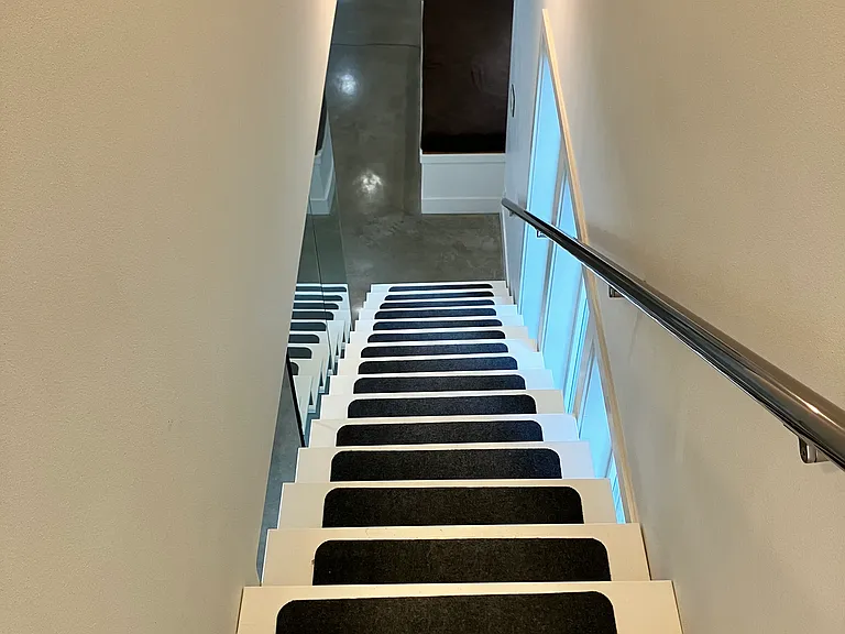 Stairs looking down from Master (primary) and Office hallway (4th floor)