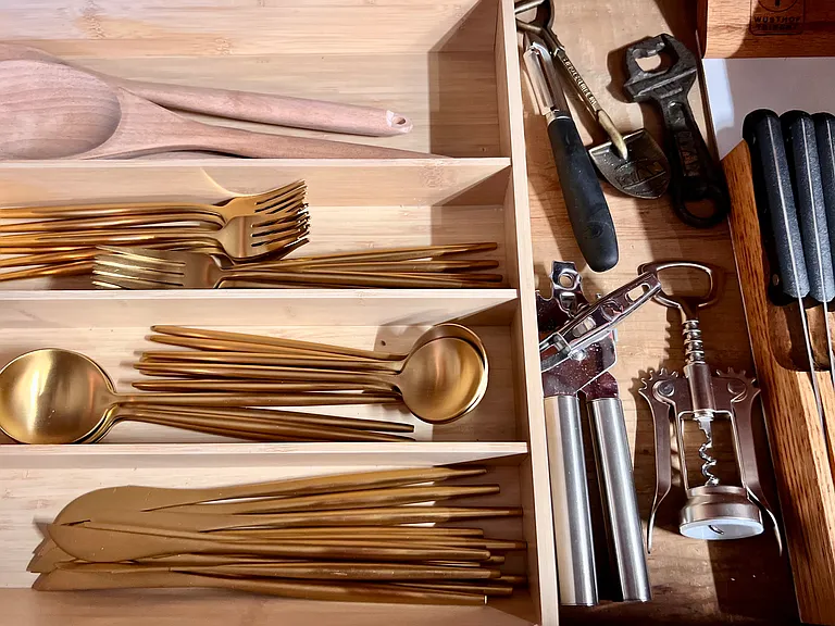 All new brass flatware and well stocked other utensils.