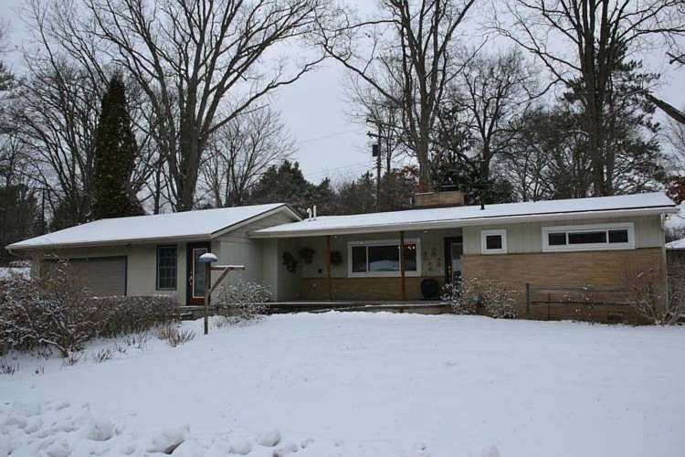 Beautiful ranch home loaded with character! Nestled onto a large 1lot this home has many wonderful features. The front walk way is a handicap accessible ramp into the home and onto the covered front porch. The interior features Hardwood flooring, double sided fireplace, Remodeled kitchen with solid Cherry cabinets and stainless appliances.  Many windows allow views of the yard and many garden areas.  Centrally located to both Midland and Mt. pleasant this home is just waiting for new owner to add their own personal touches.