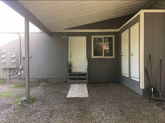 Private carport + storage unit.