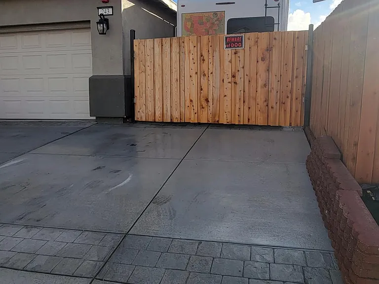 driveway allowed 3 cars parking and the sideway has room for parking an RV