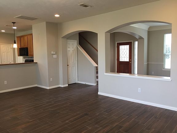 View from family room: front door and formal dining room
