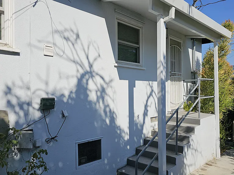 Another angle looking at stairs leading to rear door.