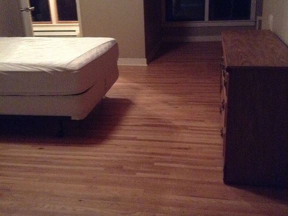 hardwood floors and vaulted wood ceiling