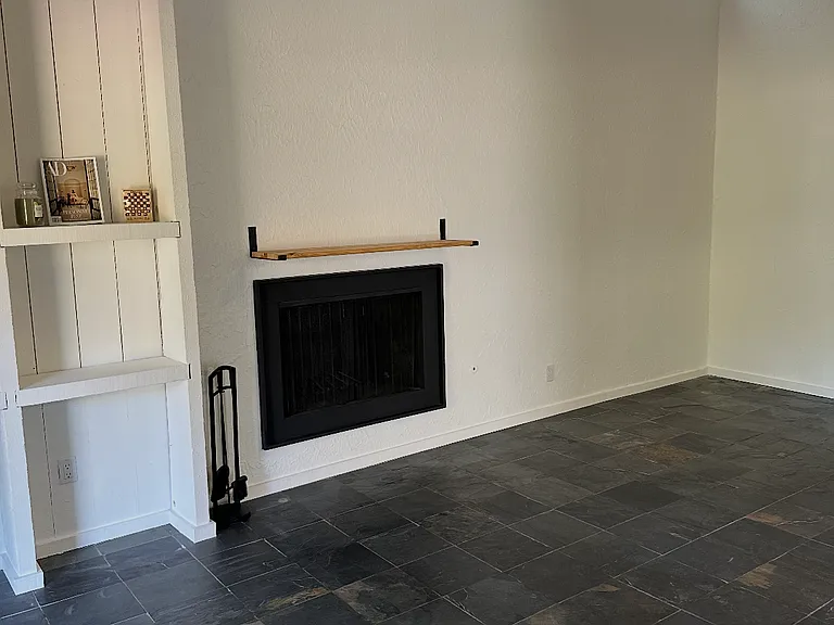 wood burning fireplace & built in bookcase