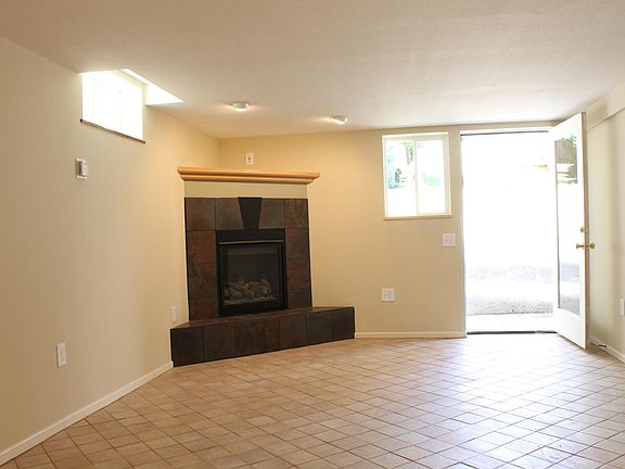 Great room fireplace and entrance from patio