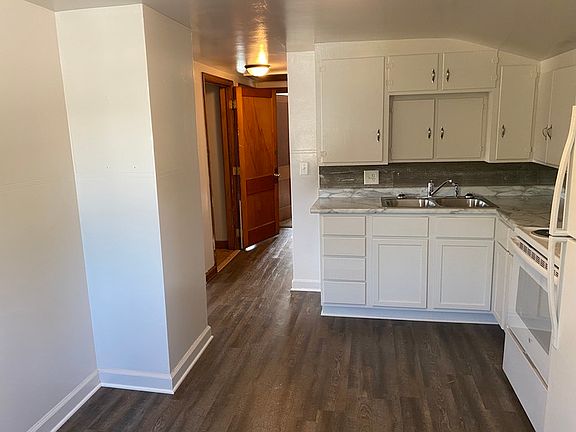 Bright and spacious living room inside this 2-bedroom upper apartment for rent in Wausau, WI, featuring abundant natural light and an open layout.