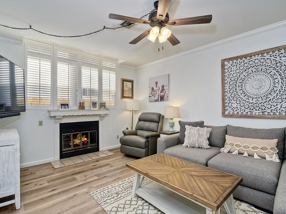 Cozy Gas Fireplace. Leather La-Z-Boy Recliner and oversized sectional