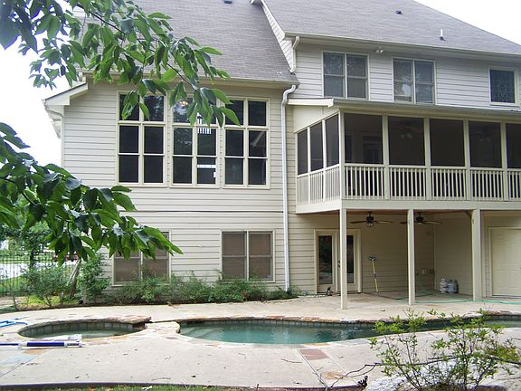 Back of house with covered porch