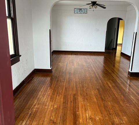 View from balcony porch - living room, dining room, yellow walls in bedroom at back