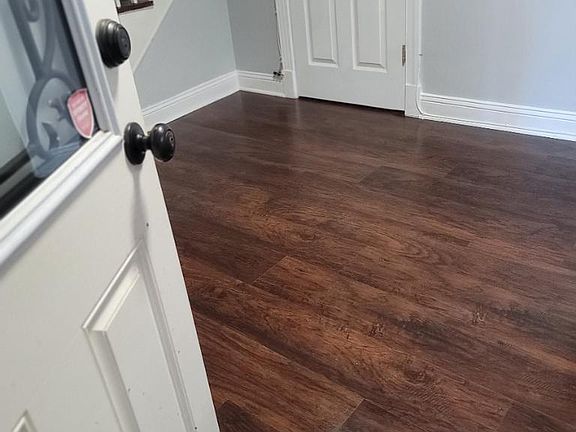 Walk into this super cute living room with fresh paint and new flooring.