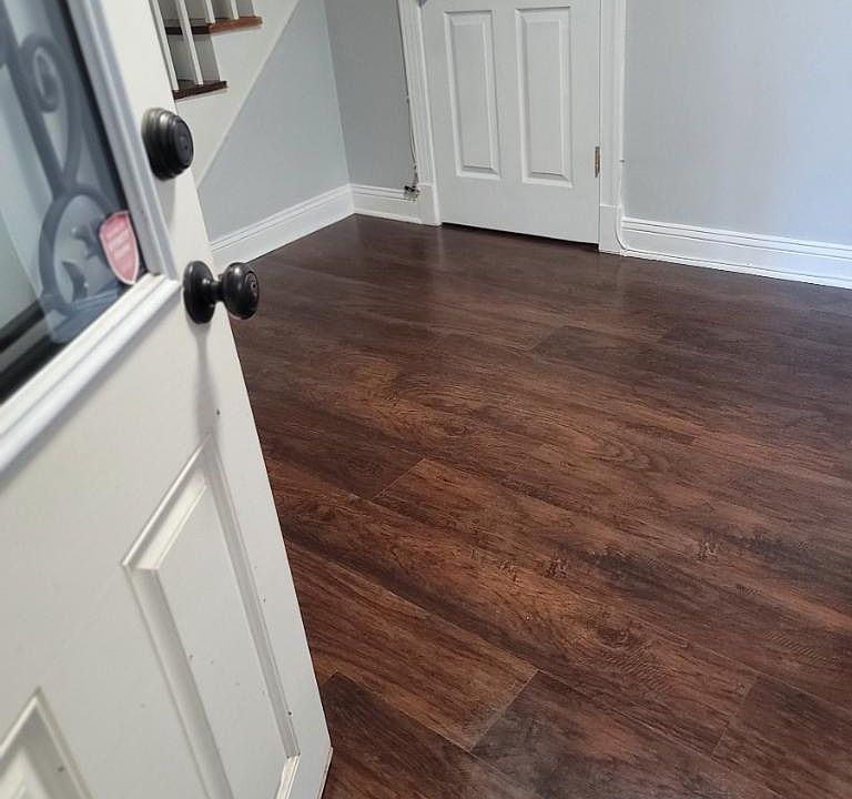 Walk into this super cute living room with fresh paint and new flooring.