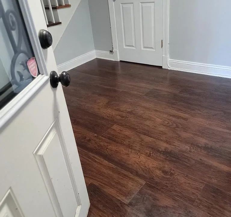Walk into this super cute living room with fresh paint and new flooring.
