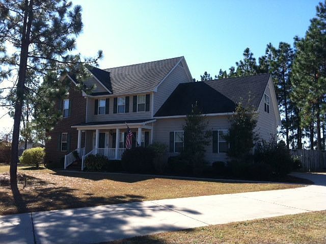 Beautiful home on .98 fenced acres.