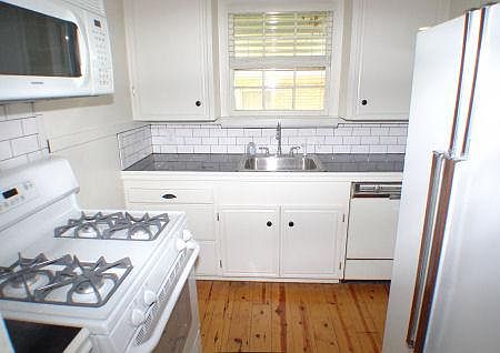 Granite Countertop, all appliances including microwave, original refinished pine floor