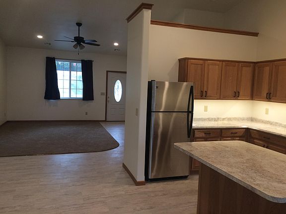 Looking into the living room with large windows for lots of natural light.