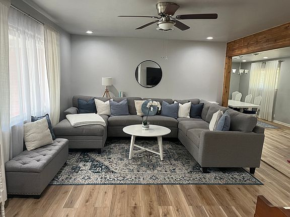 Open concept, spacious living area with natural light. New flooring.