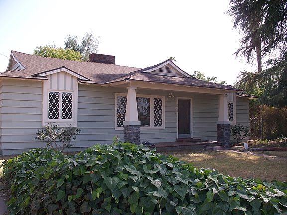 Front view with cedar tree