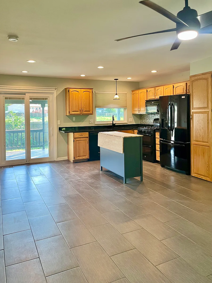 Kitchen/Dining Area walks out to covered deck and fenced back yard - 1255 S Biscay St