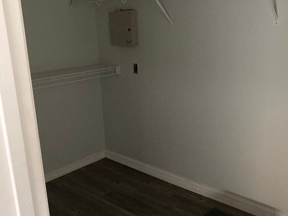 Huge walk in closet! Shelves on all sides!