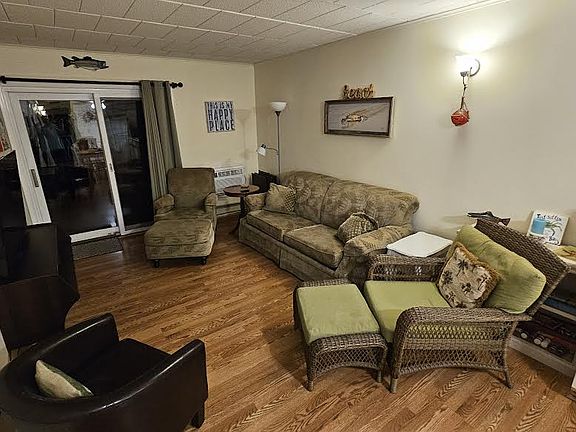 Living area with plenty of seating and waterfront view.