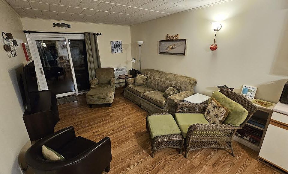 Living area with plenty of seating and waterfront view.