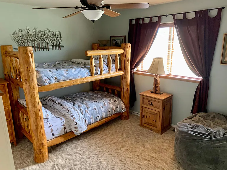 Bunk room with additional Nugget futon and queen air mattress options.