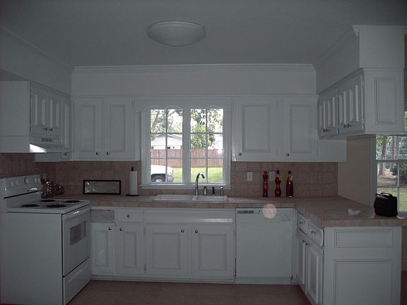 Kitchen with hand tiled counter tops and back splash