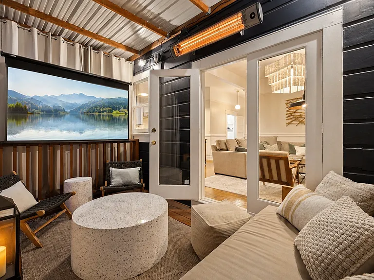 A rare San Francisco luxury: your own private and heated outdoor movie lounge with an 80" projector screen, surround sound - surrounded by lush garden greenery. An unforgettable space for entertaining, movie nights, or unwinding.