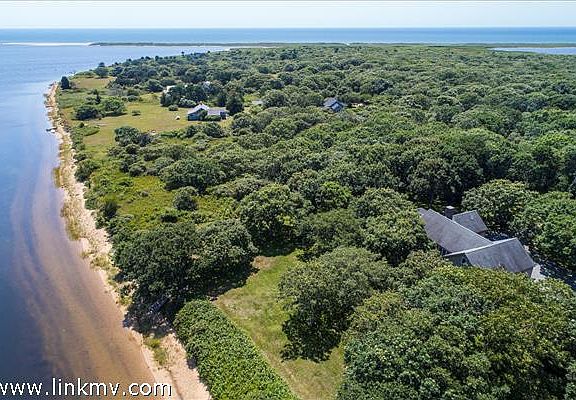 This lovely Chilmark property has pond frontage on Tisbury Great Pond as well as views of and access to the Atlantic.