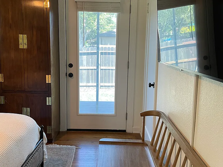 Door from primary bedroom to backyard deck