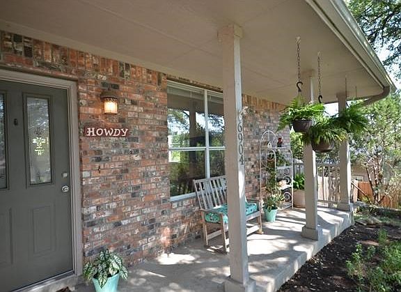 A friendly front porch says "Howdy" even without the sign. A welcoming spot to unwind.