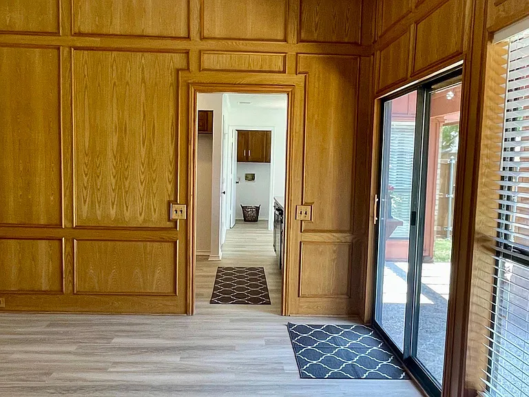 360 Solid Oak Custom ceiling to floor wall treatments.
Entrance to Eat In Kitchen
& Laundry Room