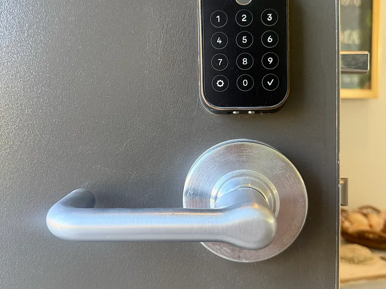 Front door entry with key code Yale lock