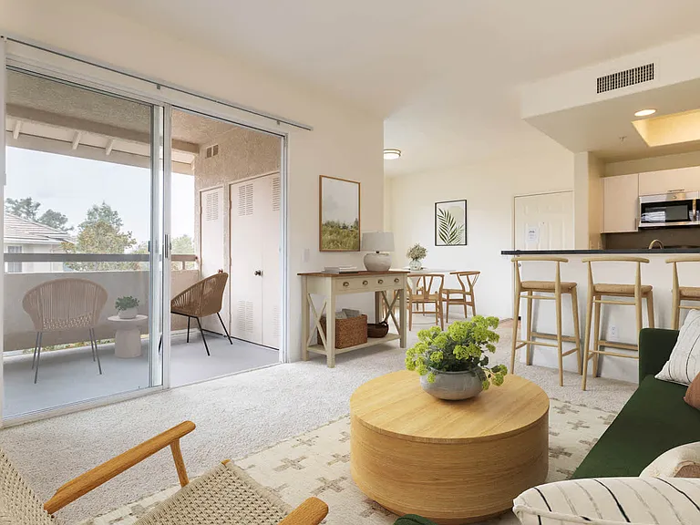 Carpeted Living Room with Balcony