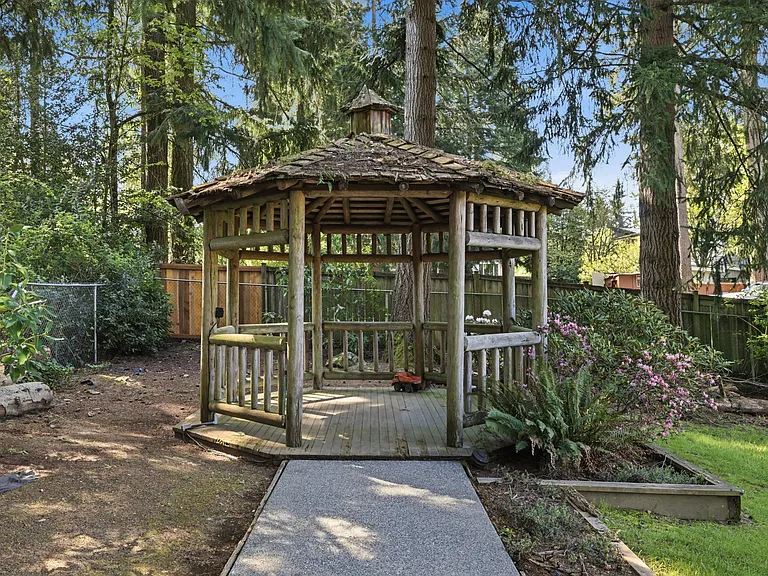 Cedar gazebo tucked among the trees _ a peaceful retreat