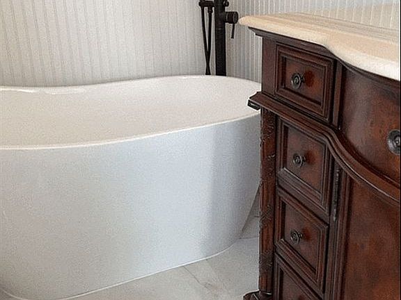 Bath with soaking tub. 