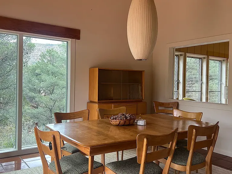Dining area with natural light and mid-century character