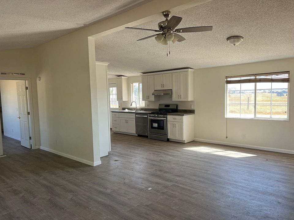 Open kitchen, dining and living room concept. New floors, paint, new blinds currently being installed.