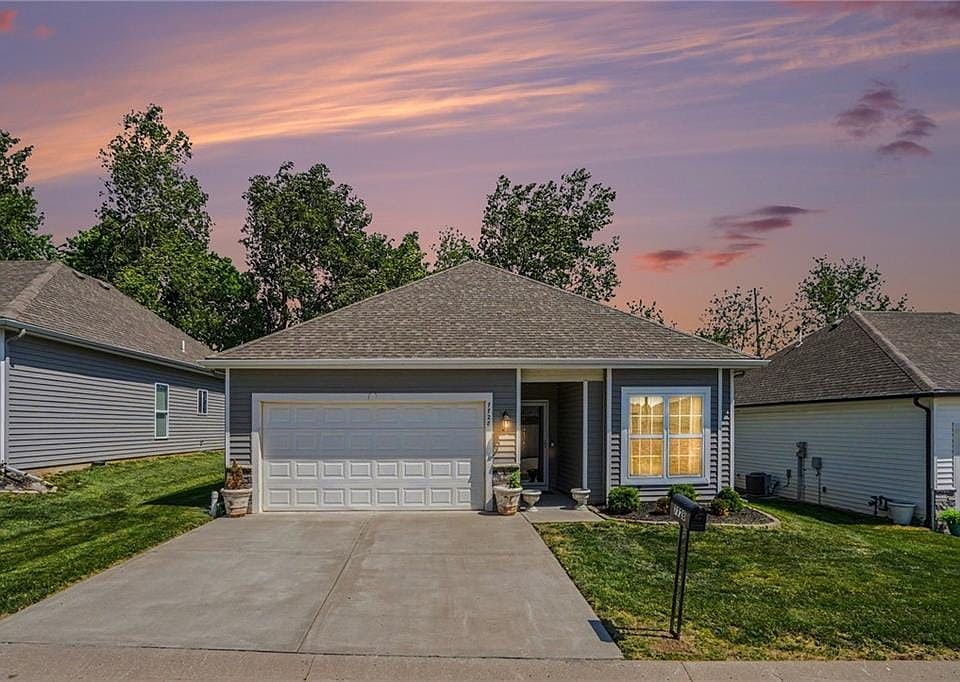 Virtually enhanced with twilight look for sky and interior lights on in windows