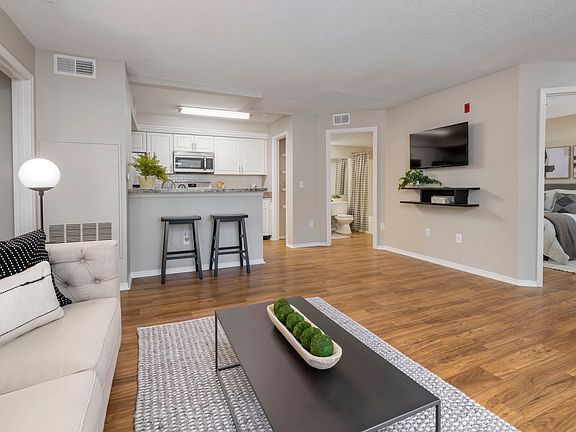 Delve into spacious living areas with wood-style flooring - your canvas for life's grand moments.