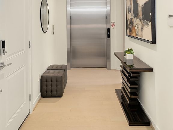 After a quick elevator ride walk right into your private entry foyer. 