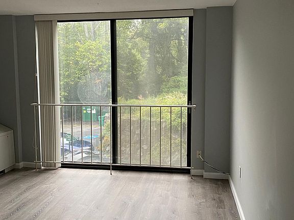 Livingroom with a sliding door to a beautiful natural view.
