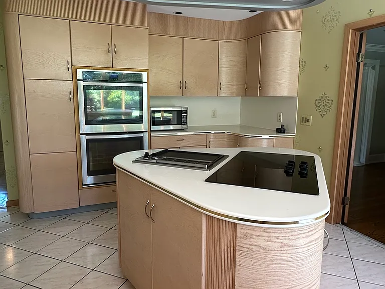 Kitchen island with electric stove and built-in griddle.