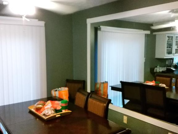 Kitchen, breakfast nook adjacent to sliding glass door leading out onto Upper Deck with sweeping views of Lake Churchill
