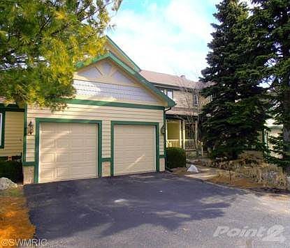 Attached two-car garage includes two-step entry to foyer for easy access to kitchen as well as door to partial basement and crawl space where utilities are located.