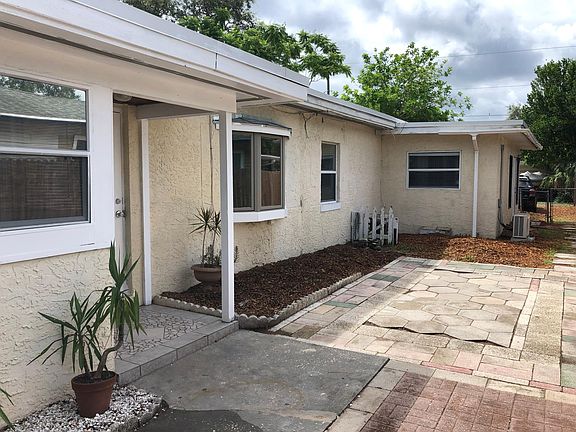 Entrance is on the side with a private patio.