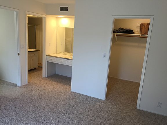 Master Bedroom walk-in closet, seated vanity/makeup area and