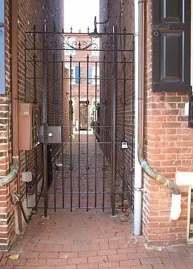 Gated alley from street to house